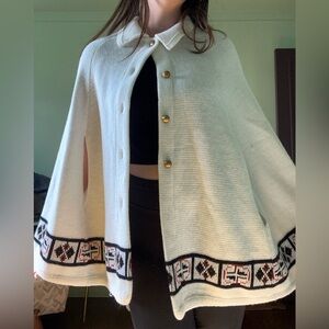 White Cape with Black and Brown Trim